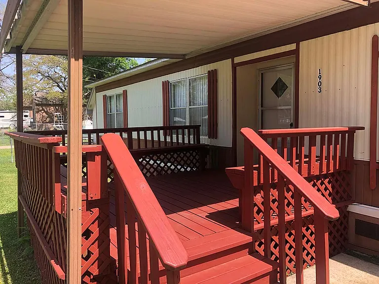 Decked and covered porch with all around bench seating.