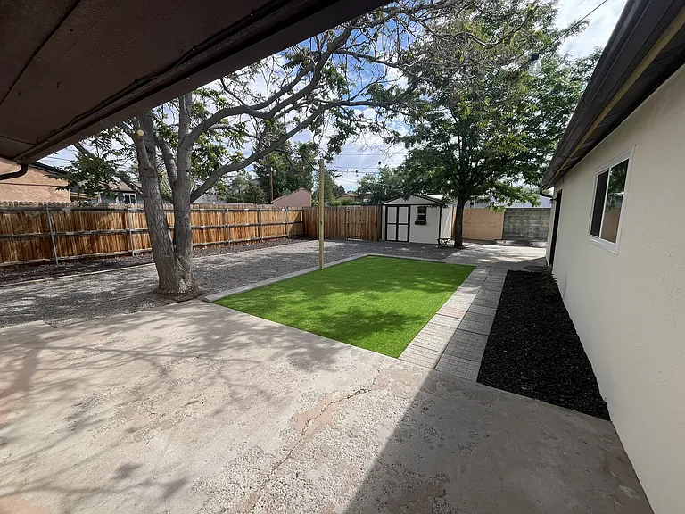 Back Yard with Artificial Grass Low Maintenance & 2 Storage Sheds