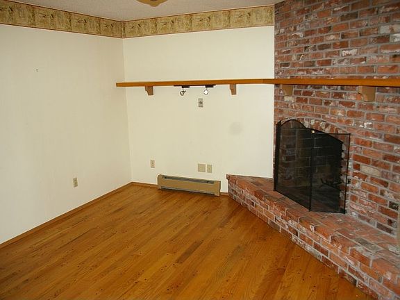 Charming den with brick fireplace