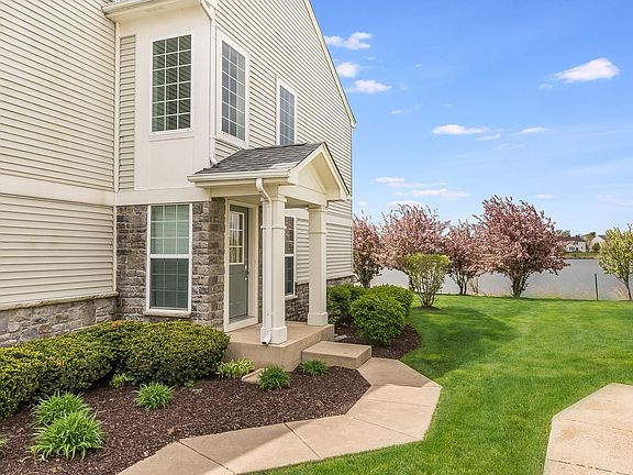 Private, side entrance with a cute covered front porch.