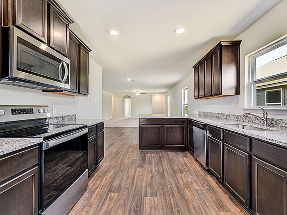The kitchen comes with a full suite of energy-efficient appliances