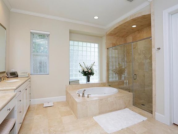 Another view of master bathroom with separate soaking tub and huge shower.