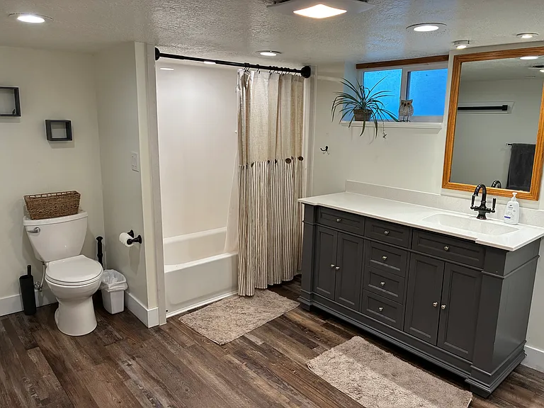 New bathroom downstairs, cultured marble shower and counter.