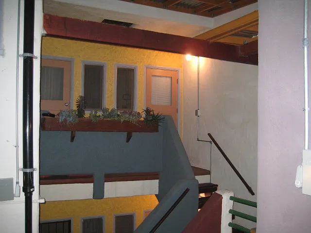 Rear entrances and plant shelf at balcony/stair.