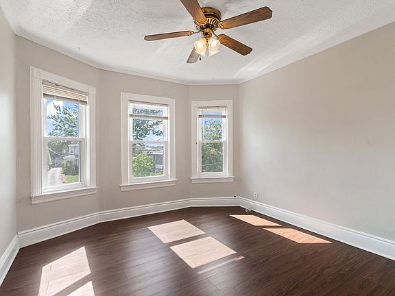 Charming living room with new windows, freshly painted and new floors.