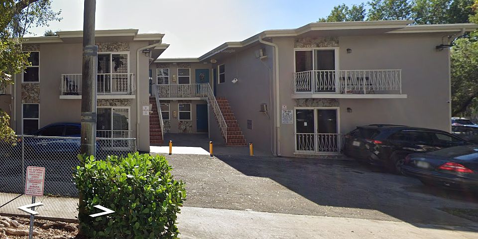 Building exterior with parking.