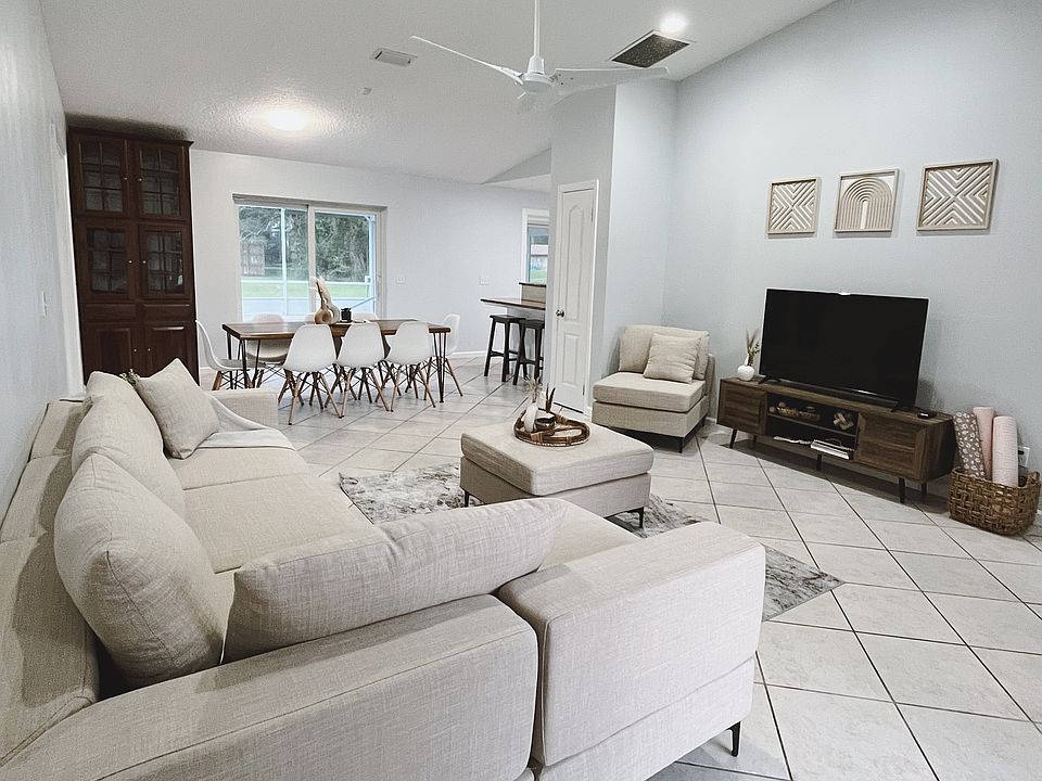 Spacious living room with plenty natural light and Smart TV