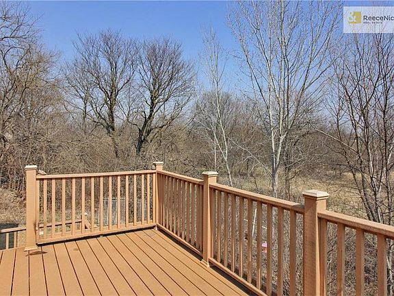 Empty lot to the North, trees, trees, trees behind the deck for bird watching, critters and a measure of privacy.
