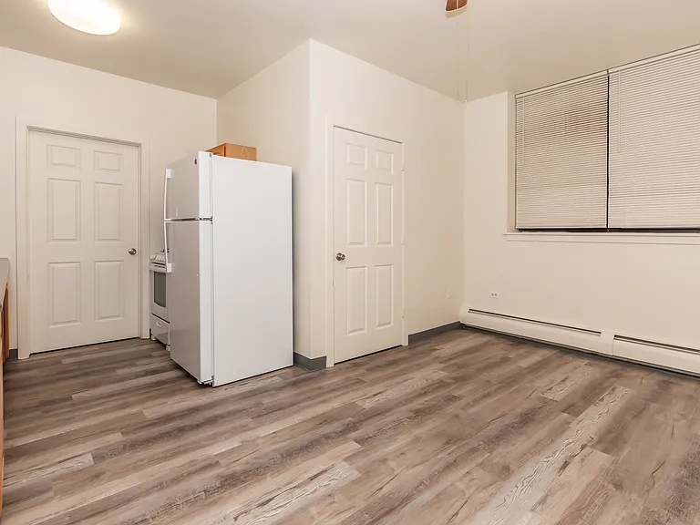 1 bedroom 1 bathroom ADA unit kitchen and living room area.