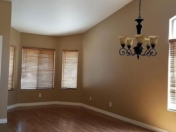 The front entry opens up into this well-lit and spacious sitting and dining area.