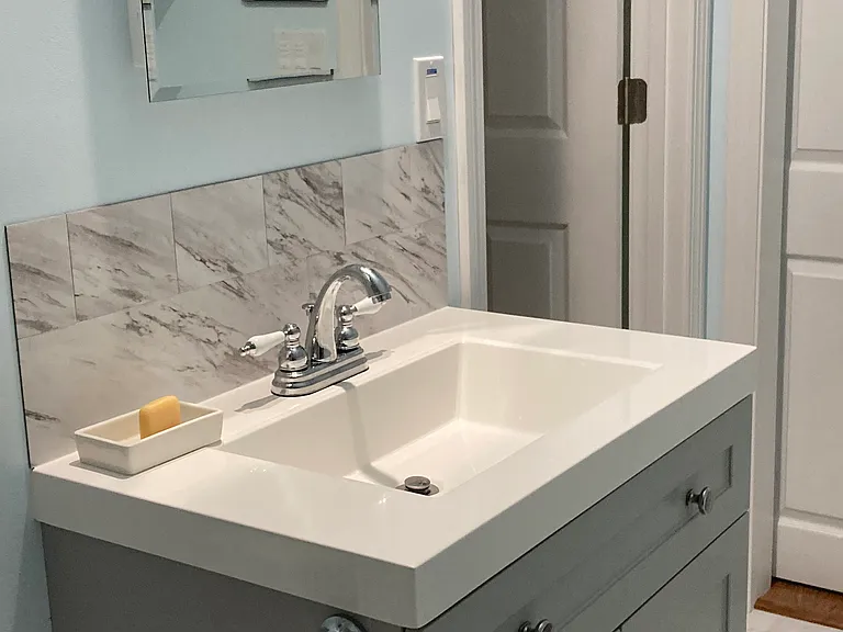 bathroom opening to kitchen and/or bedroom