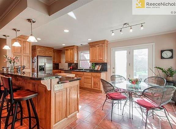 Kitchen has been completely remodeled! Custom bar stools stay with home!