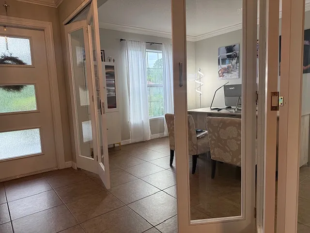 Dedicated home office with elegant French doors_ideal for remote work,, it could be use as a room as well