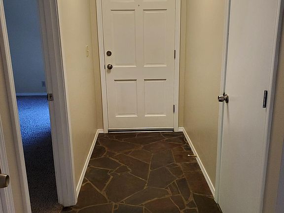 Hall way- back of Front door. Coat closet on the right, entry into Family room on the left