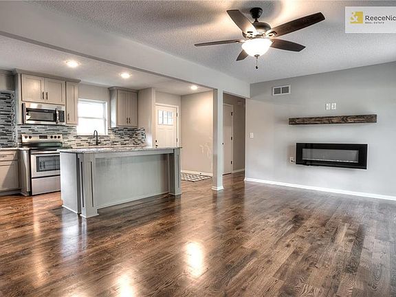 Open floor plan with wood floors