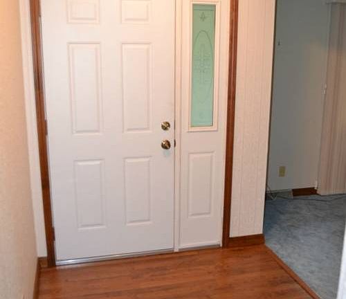 Once inside the entry is a generous size.  It has newer laminate flooring in a warm inviting color.  There is also a large coat closet to store all of your cold weather gear.