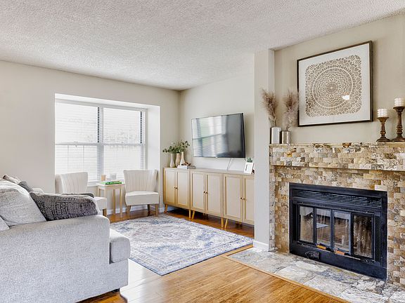 Cozy up by the fireplace in the spacious living room_perfect for relaxing or entertaining