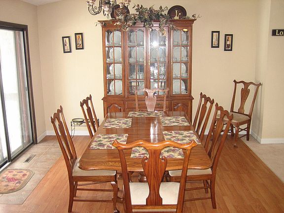 Dining area with backyard patio to left and front room to right