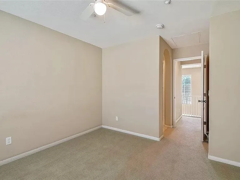 Bedroom 2. Has been converted to hardwood flooring (not shown).
