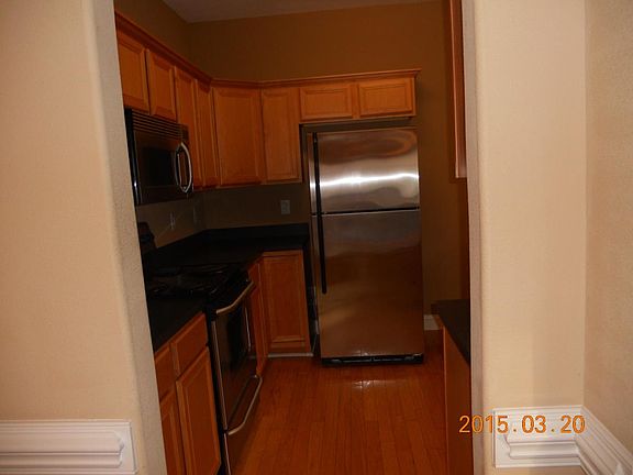 Cherry and stainless kitchen with pantry