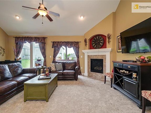 Great Room has gas fireplace and sliding door to the deck