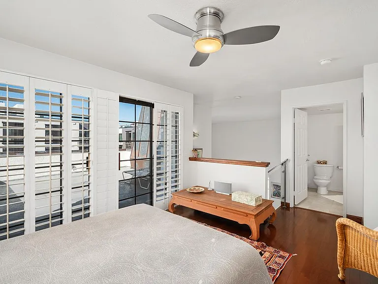 Plantation shutters in guest bedroom