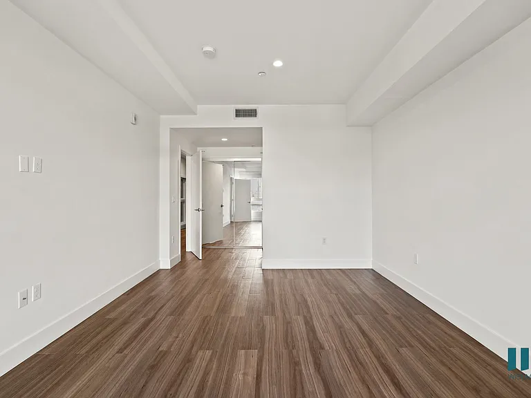Bedroom with Vinyl Flooring and Recessed Lighting