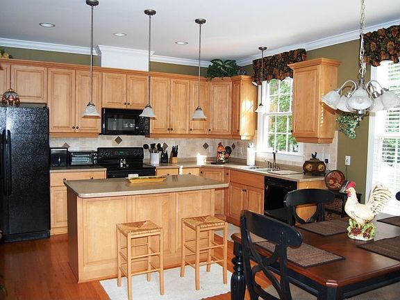 Glazed maple cabinets and solid surface counters!