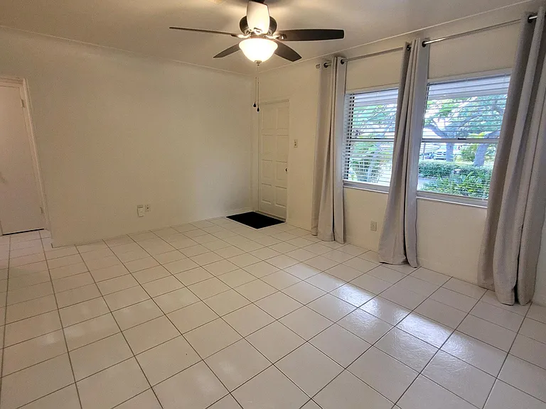 Spacious living room with front door entry