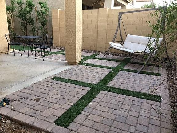 Private, carefree backyard with artificial turf