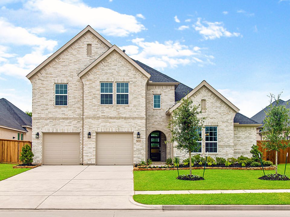 Fully landscaped front yard makes for excellent curb appeal