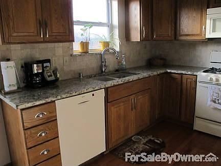 Kitchen View 1 (Granite Countertop with Travertine Backsplash)