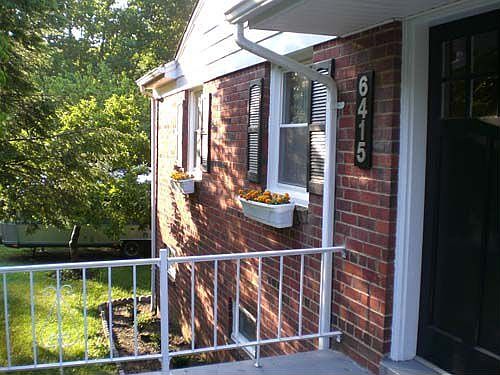 view from front porch -- newly updated with shutters, window boxes, lg numbers