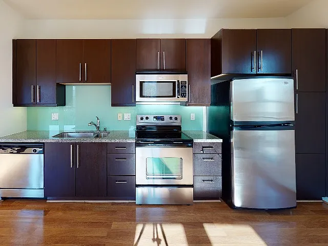Beautiful finishes include glass backsplash