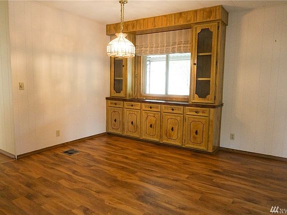 The dining area with a built-in side bar & hutch.