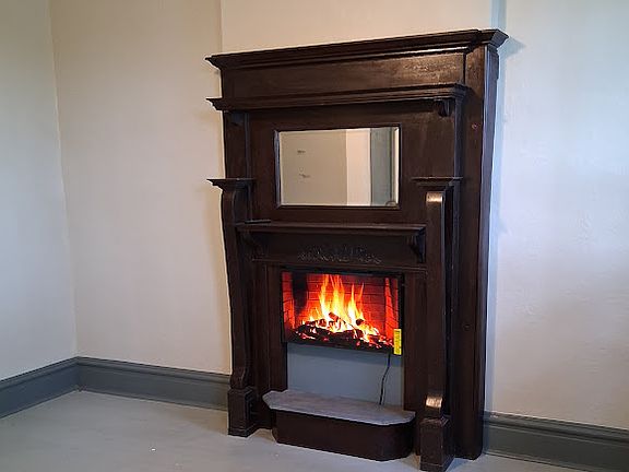 Flat screen fireplace is a TV also.