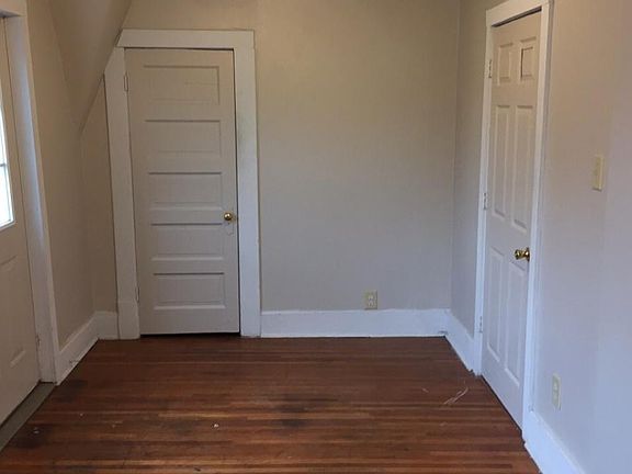 upstairs bedroom with balcony