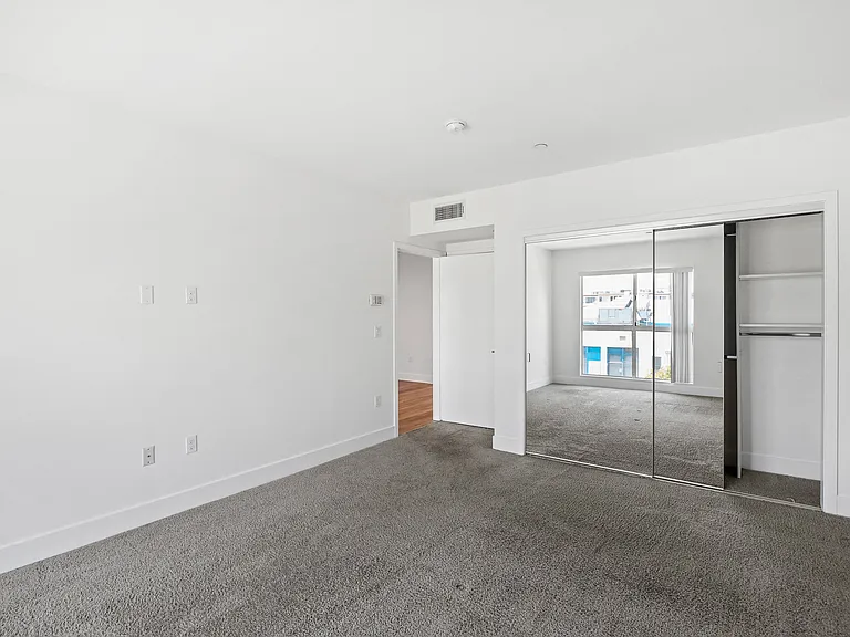 Bedroom with Mirrored Closet