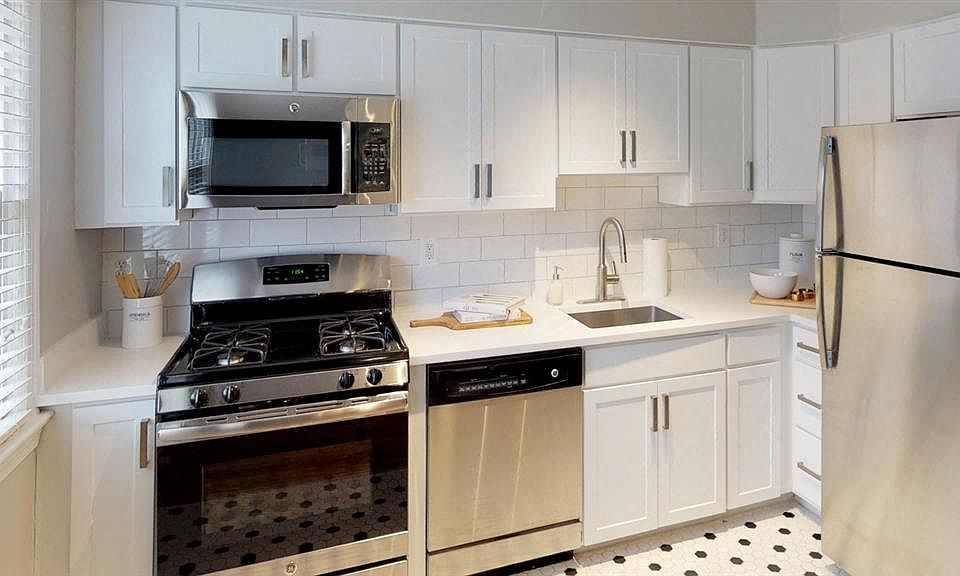 Tiled kitchens with sleek cabinetry