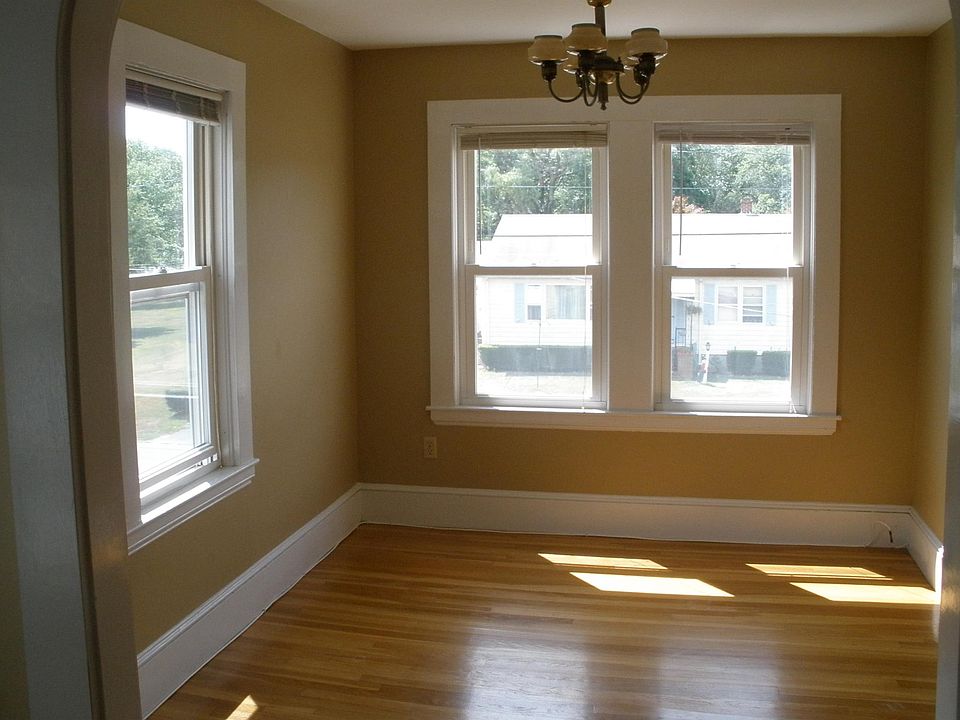 Front parlor faces south and east, allowing lots of sunshine in! Vintage alabaster ceiling light with dimmer adds charming warm light when needed.