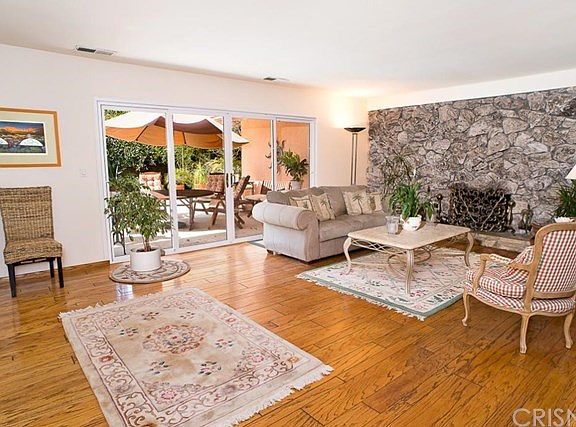 Beautiful stone accented fireplace in the living room.