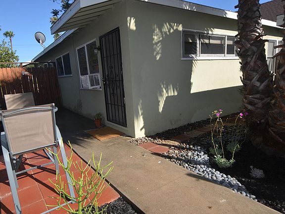 Private entrance to the unit, with an additional area for your BBQ and dining setup.