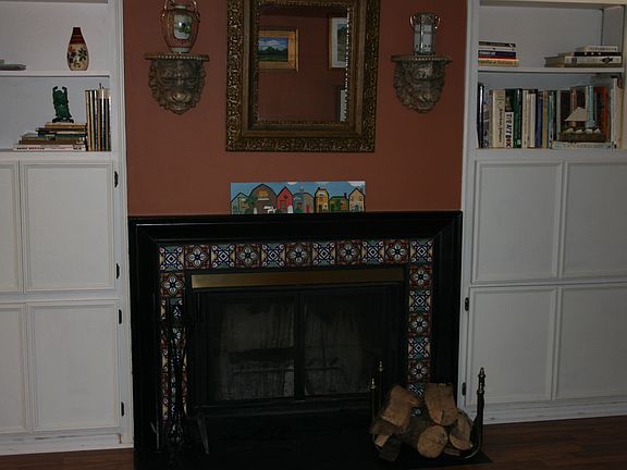 Built-ins and Wood Burning Fire Place in Den/Sitting Room