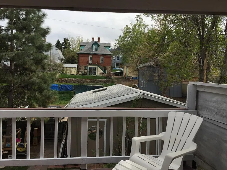 view off back balcony, mature shade trees, alley access