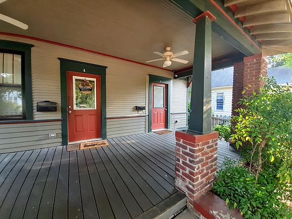 Shared front porch in picket fence garden.