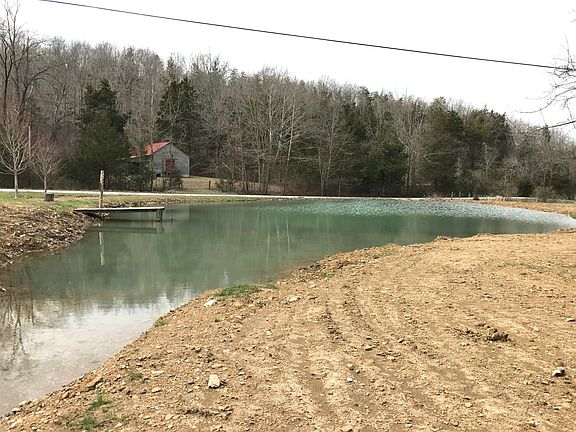 Pond w/ view of 1900s store