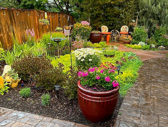 Enjoy a lovely, low-maintenance, fully fenced yard, filled with gorgeous ever-blooming perennials.