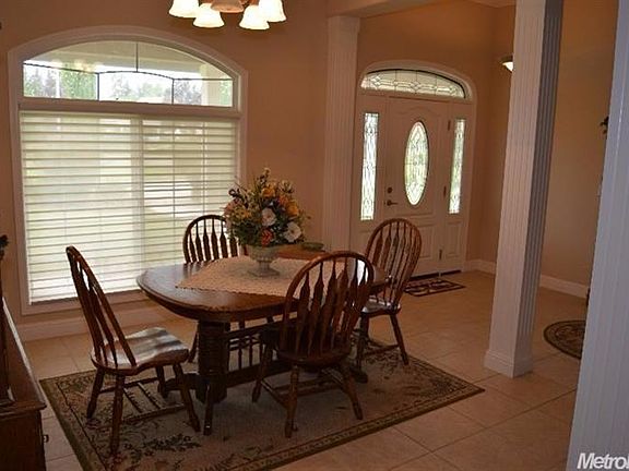 Formal Dining Area graces the right of the Forey as you enter into the home.
