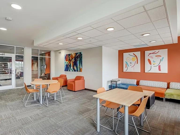 Comfortable seating and shared tables for social interaction.