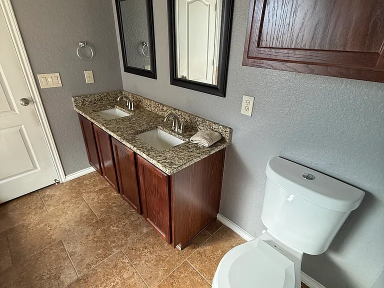 Lots of room in the downstairs bathroom with modern lighting and design